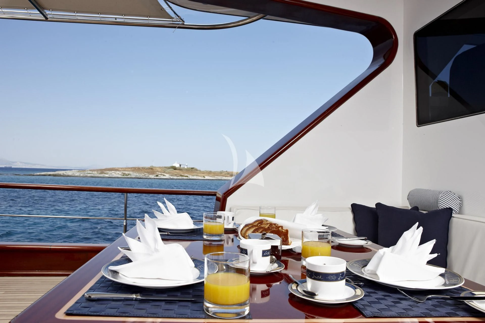 a table with food and drinks on it aboard IRAKLIS L Yacht for Charter