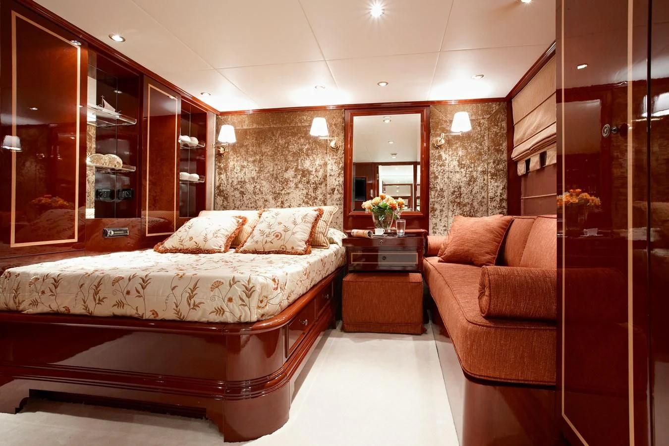 a bedroom with a bed and a couch aboard IRAKLIS L Yacht for Charter