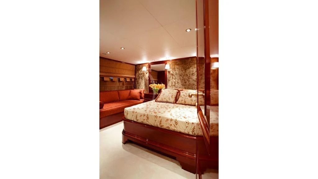 a room with a bed and a couch aboard IRAKLIS L Yacht for Charter