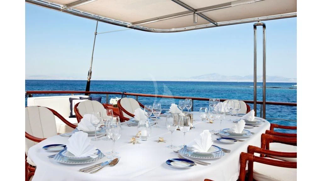 a table set for a dinner aboard IRAKLIS L Yacht for Charter