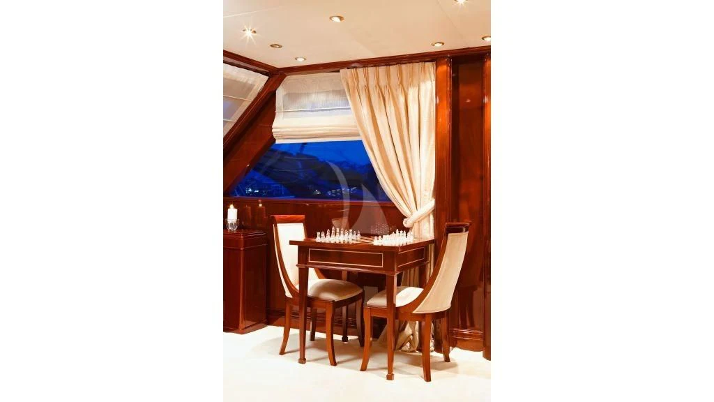 a room with a table and chairs aboard IRAKLIS L Yacht for Charter