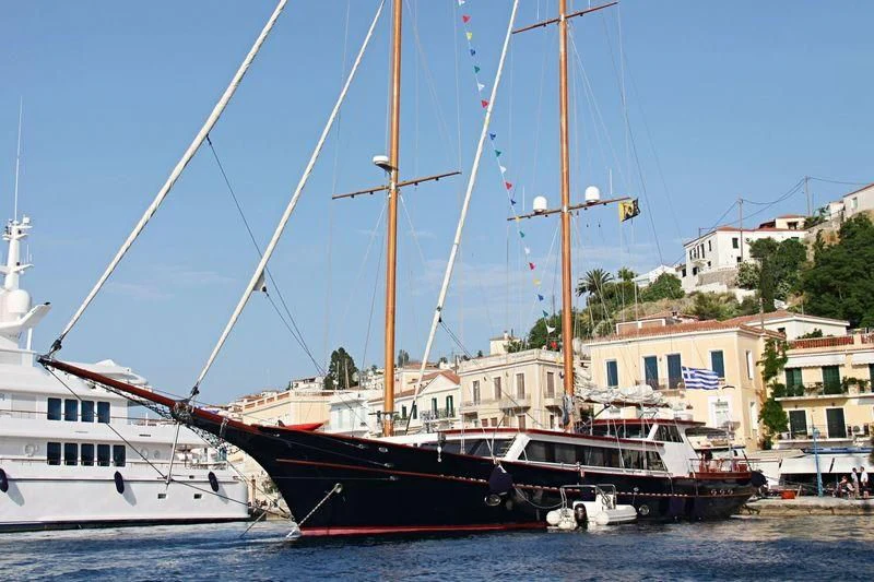a group of boats are parked in a harbor aboard IRAKLIS L Yacht for Charter