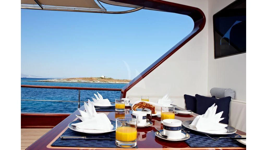 a table with food and drinks on it aboard IRAKLIS L Yacht for Charter