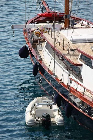 a boat with a red and white stripe on the front aboard IRAKLIS L Yacht for Charter