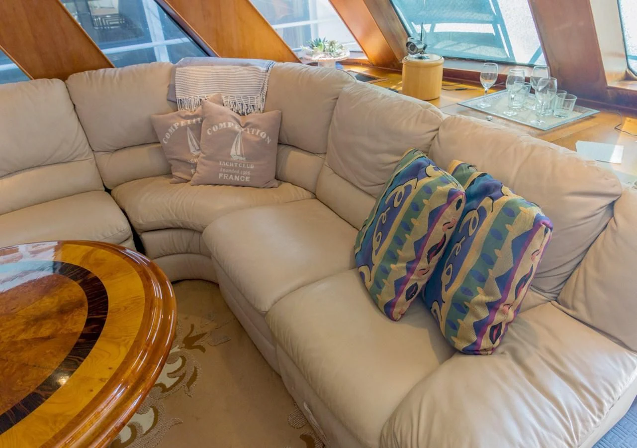a couch with a coffee table aboard LADY CHARLOTTE Yacht for Sale