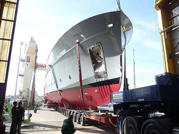 a large boat with a flag on the side aboard ELISABET Yacht for Sale