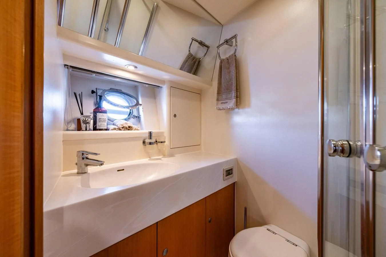 a bathroom with a sink and a mirror aboard OYSTER Yacht for Sale