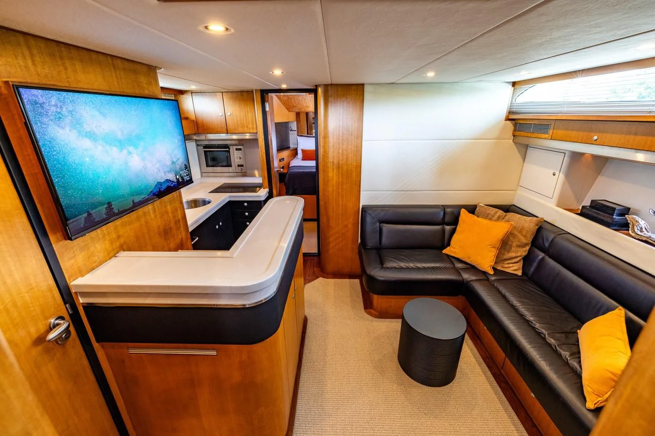 a room with a couch and a tv aboard OYSTER Yacht for Sale