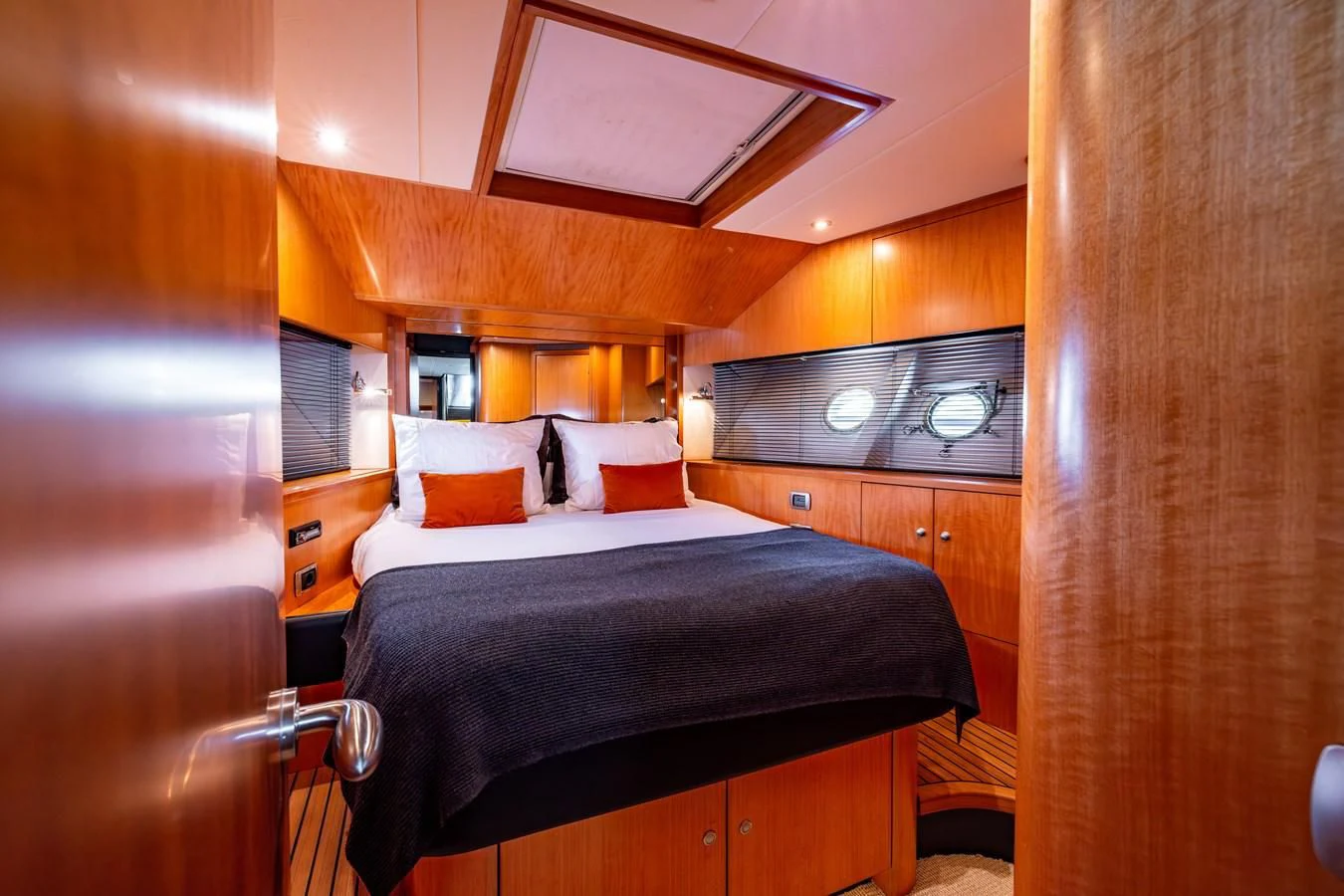 a bedroom with a bed and a microwave aboard OYSTER Yacht for Sale