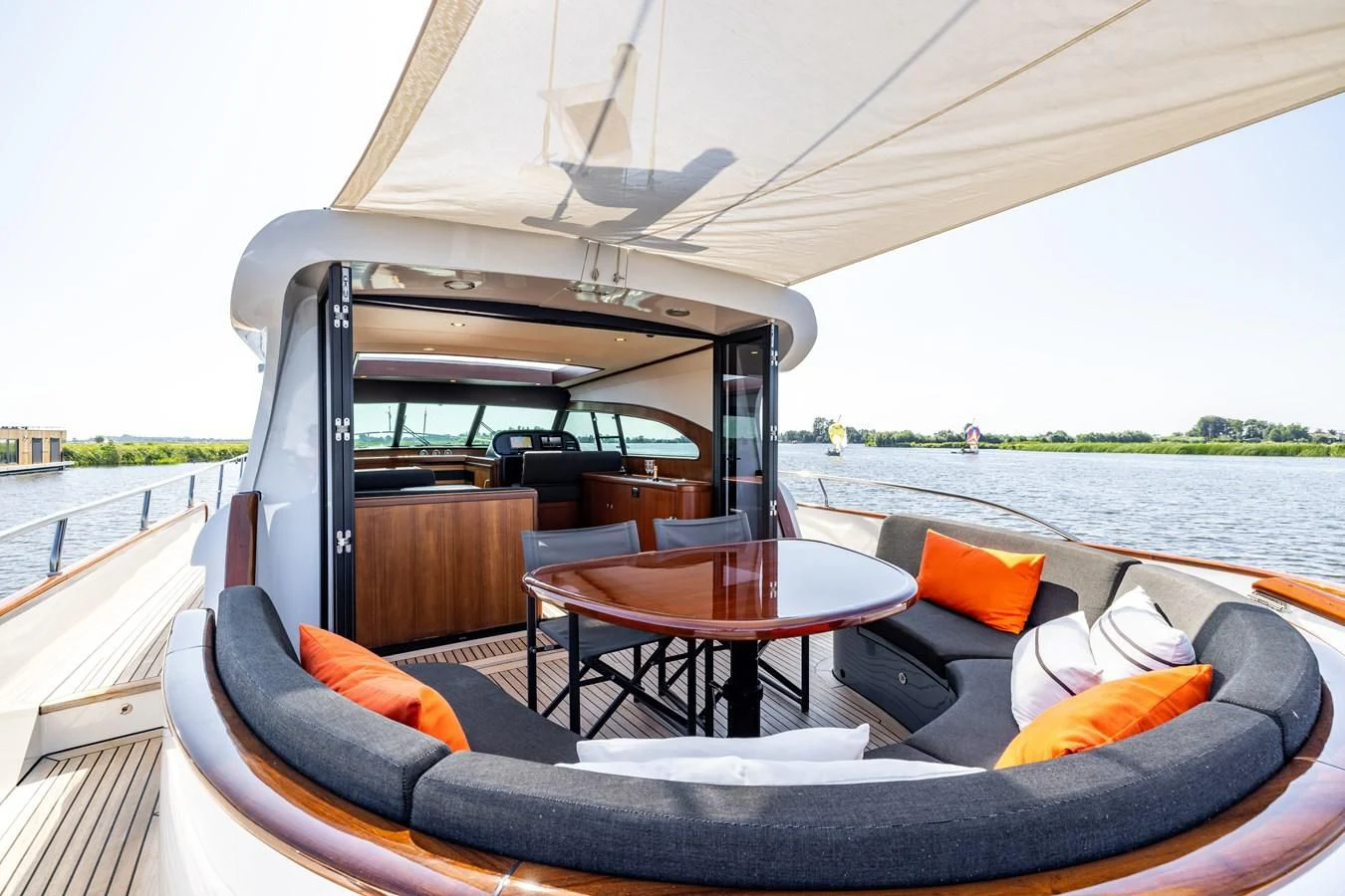 a boat with a table and chairs on it aboard OYSTER Yacht for Sale