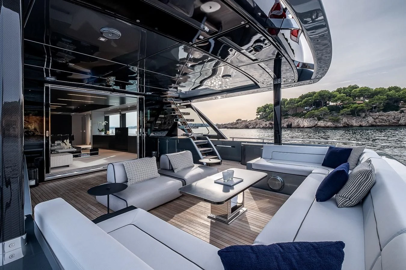 a room with a couch and a table and chairs aboard RIVIERA Yacht for Sale
