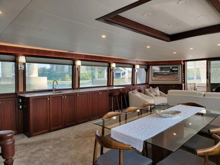 a large kitchen with a dining table aboard SOUTHERN BREW Yacht for Sale