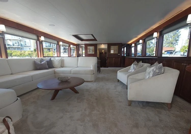 a living room with a couch and a coffee table aboard SOUTHERN BREW Yacht for Sale