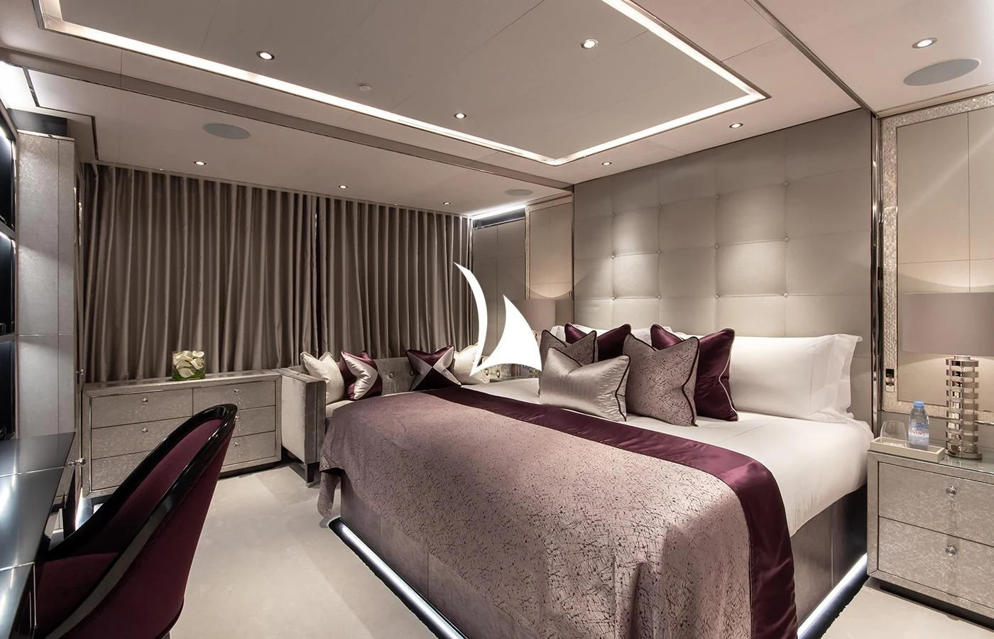 a room with a bed and a chair aboard NORTH STAR Yacht for Sale