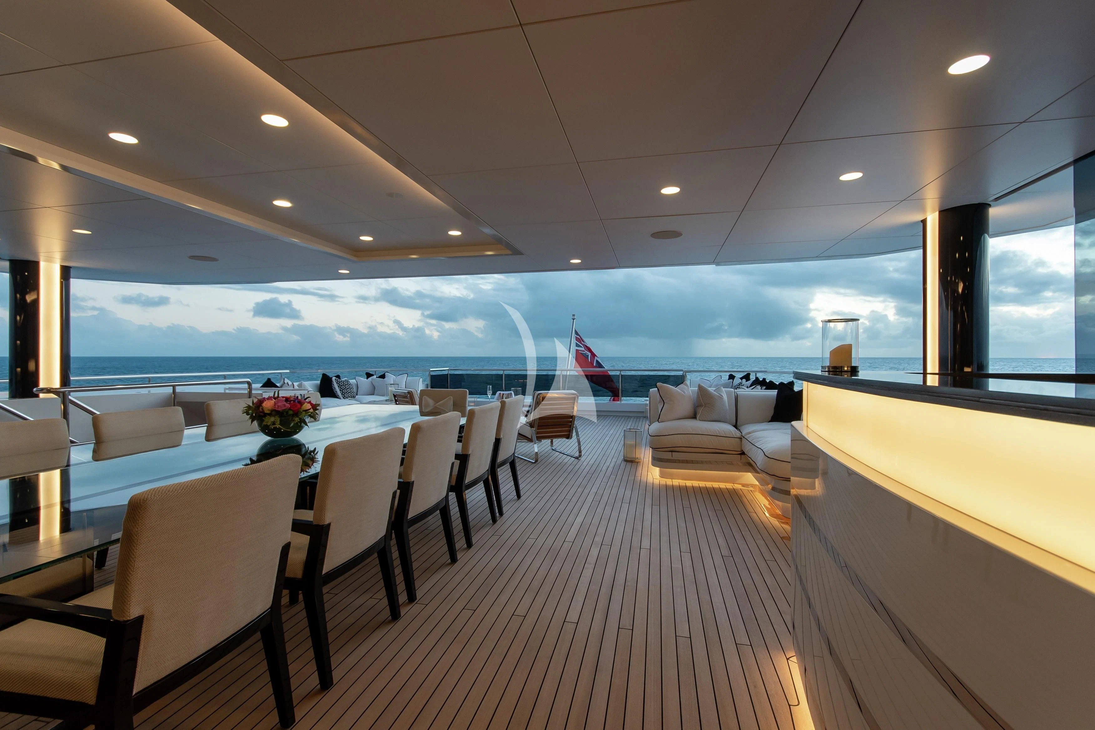 a room with a table and chairs aboard NORTH STAR Yacht for Sale