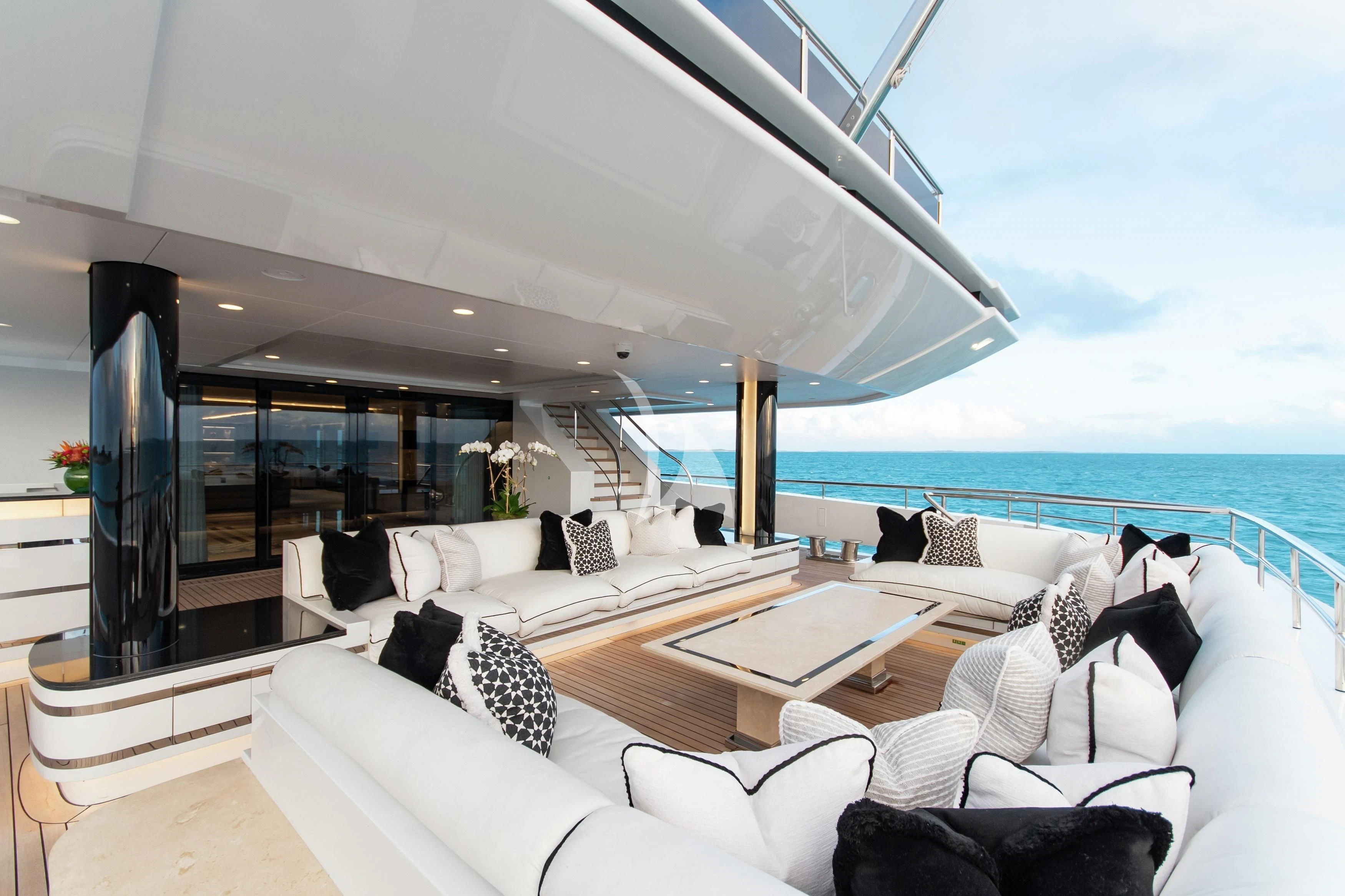 a living room with a large balcony aboard NORTH STAR Yacht for Sale