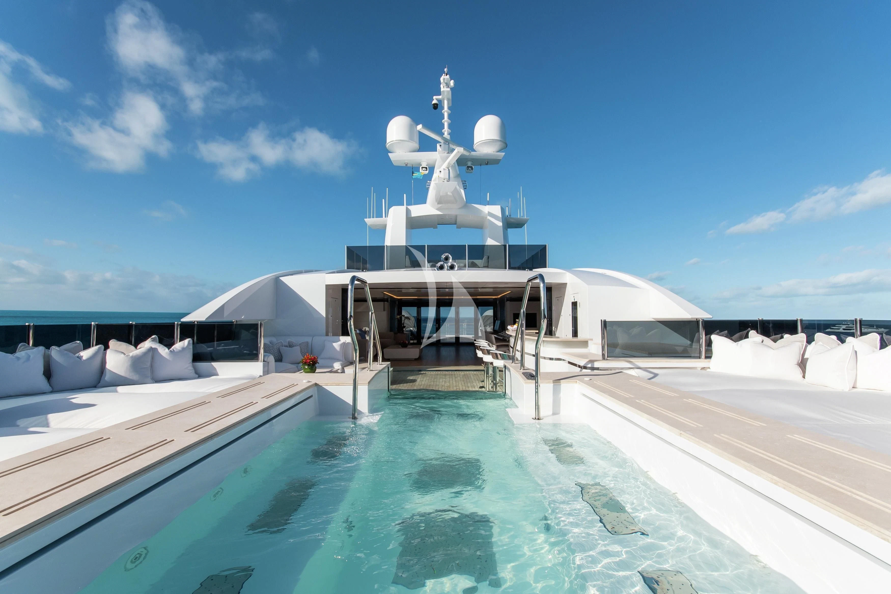 a pool with a building in the background aboard NORTH STAR Yacht for Sale