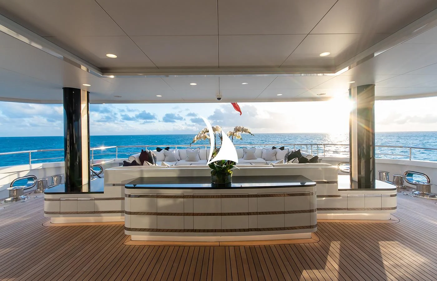 a room with a large window and a statue on the wall aboard NORTH STAR Yacht for Sale