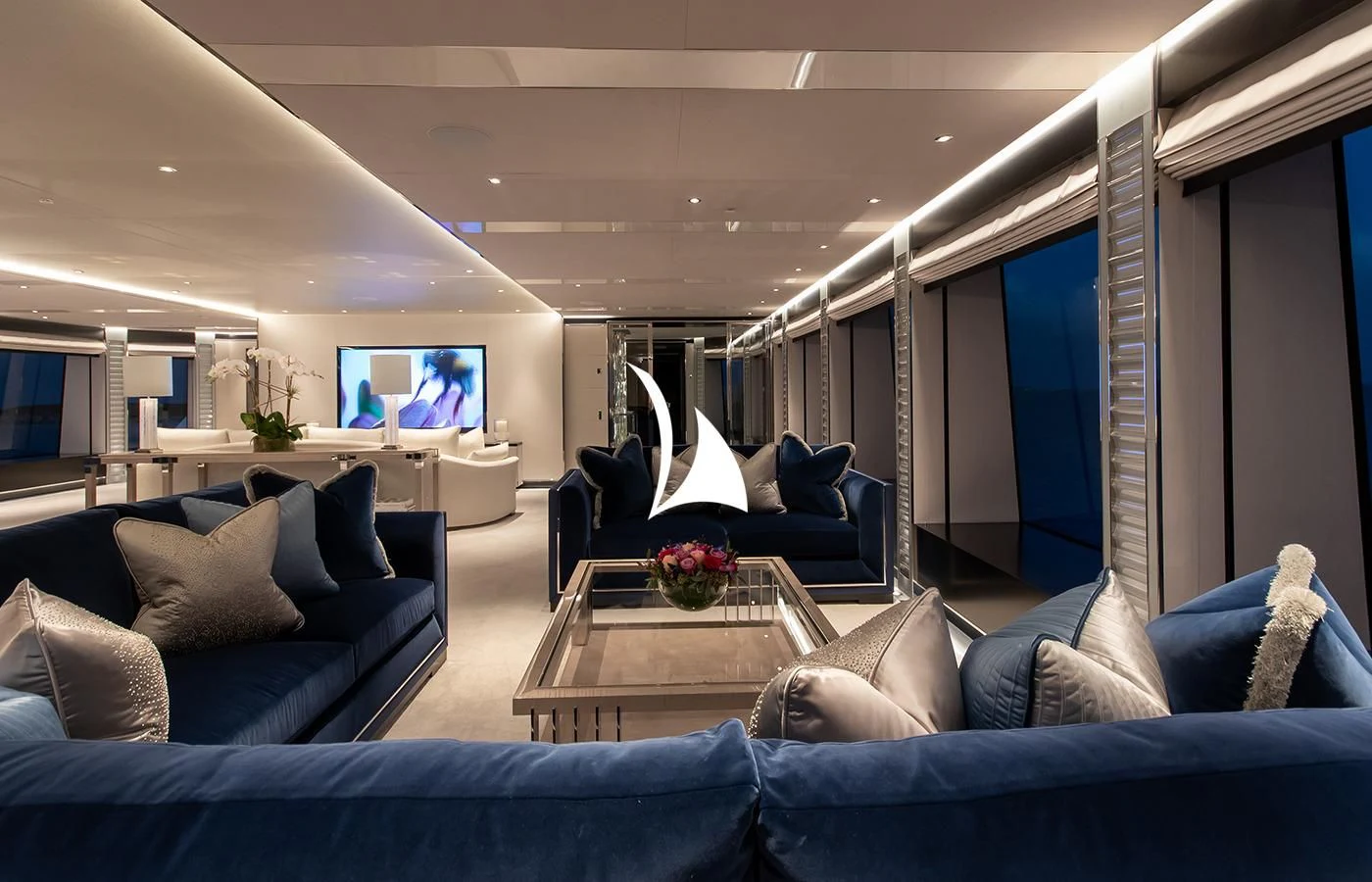 a living room with a blue couch aboard NORTH STAR Yacht for Sale