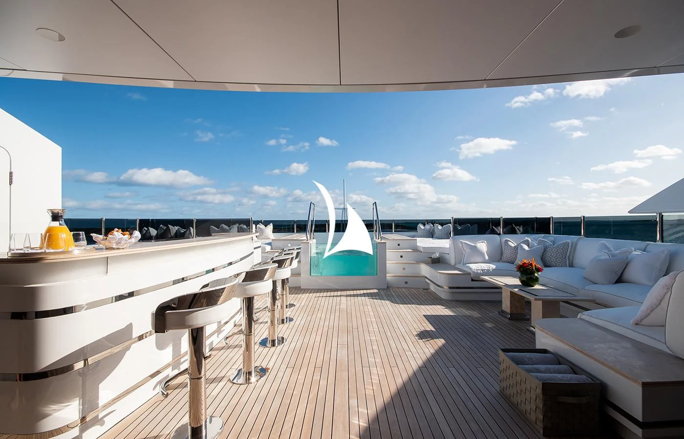 a large room with a large deck and a large pool aboard NORTH STAR Yacht for Sale