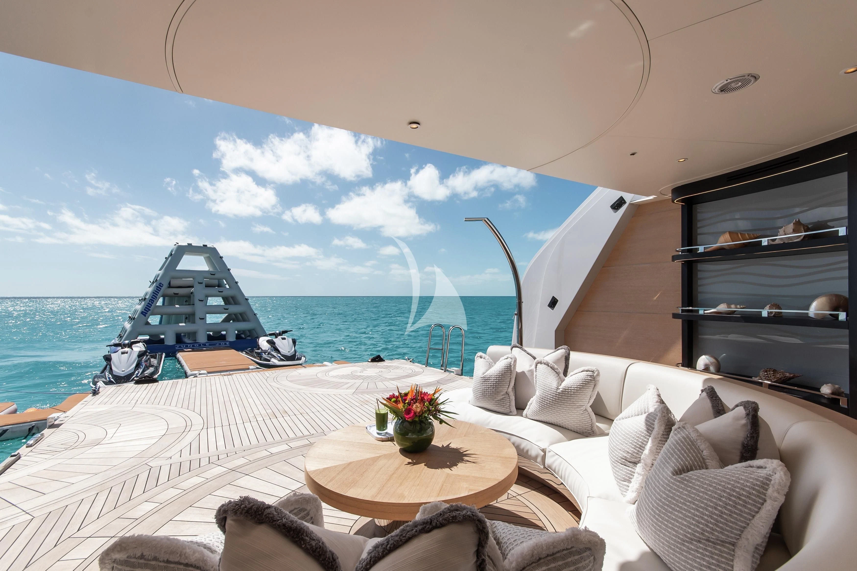 a room with a bed and a table and a view of the ocean aboard NORTH STAR Yacht for Sale