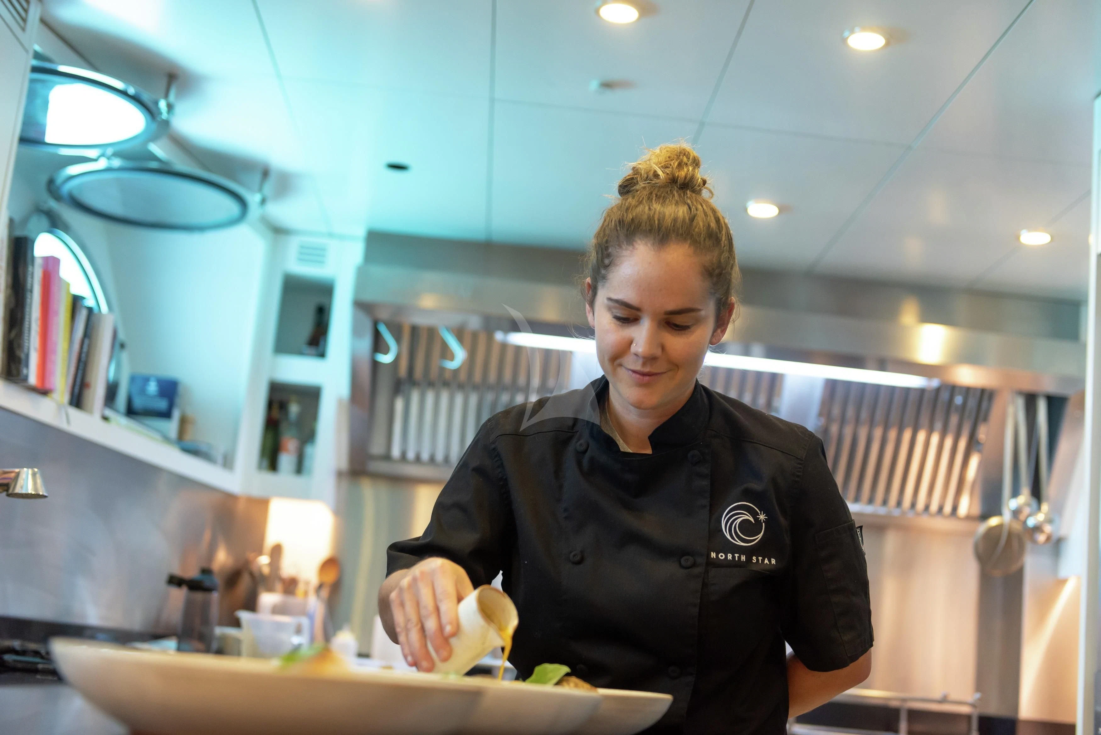 a person in a kitchen aboard NORTH STAR Yacht for Sale