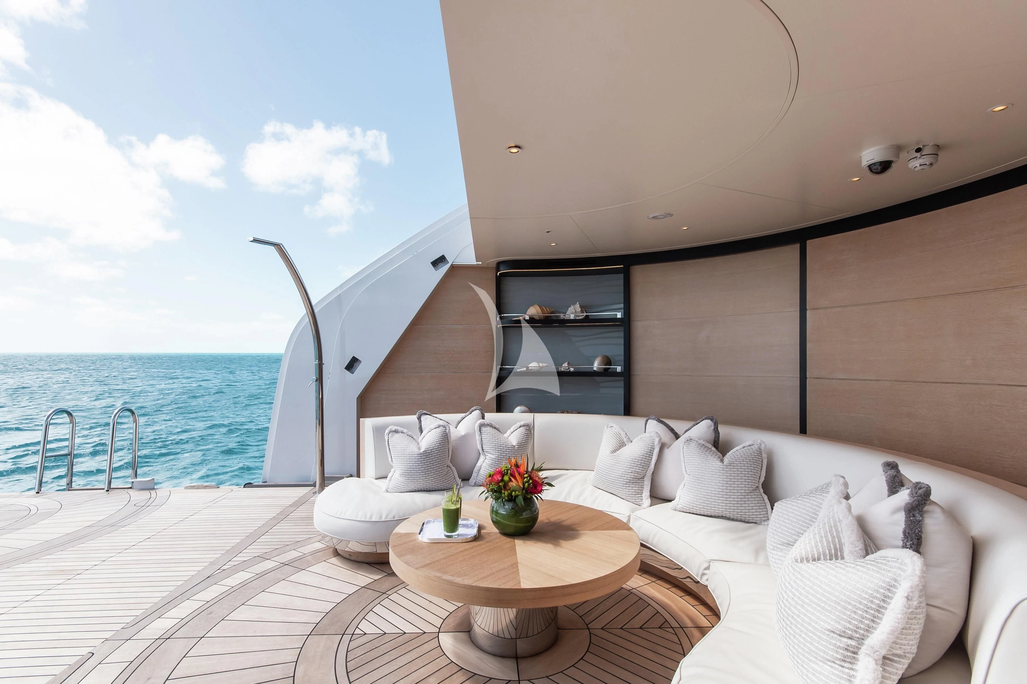 a room with a bed and a table aboard NORTH STAR Yacht for Sale