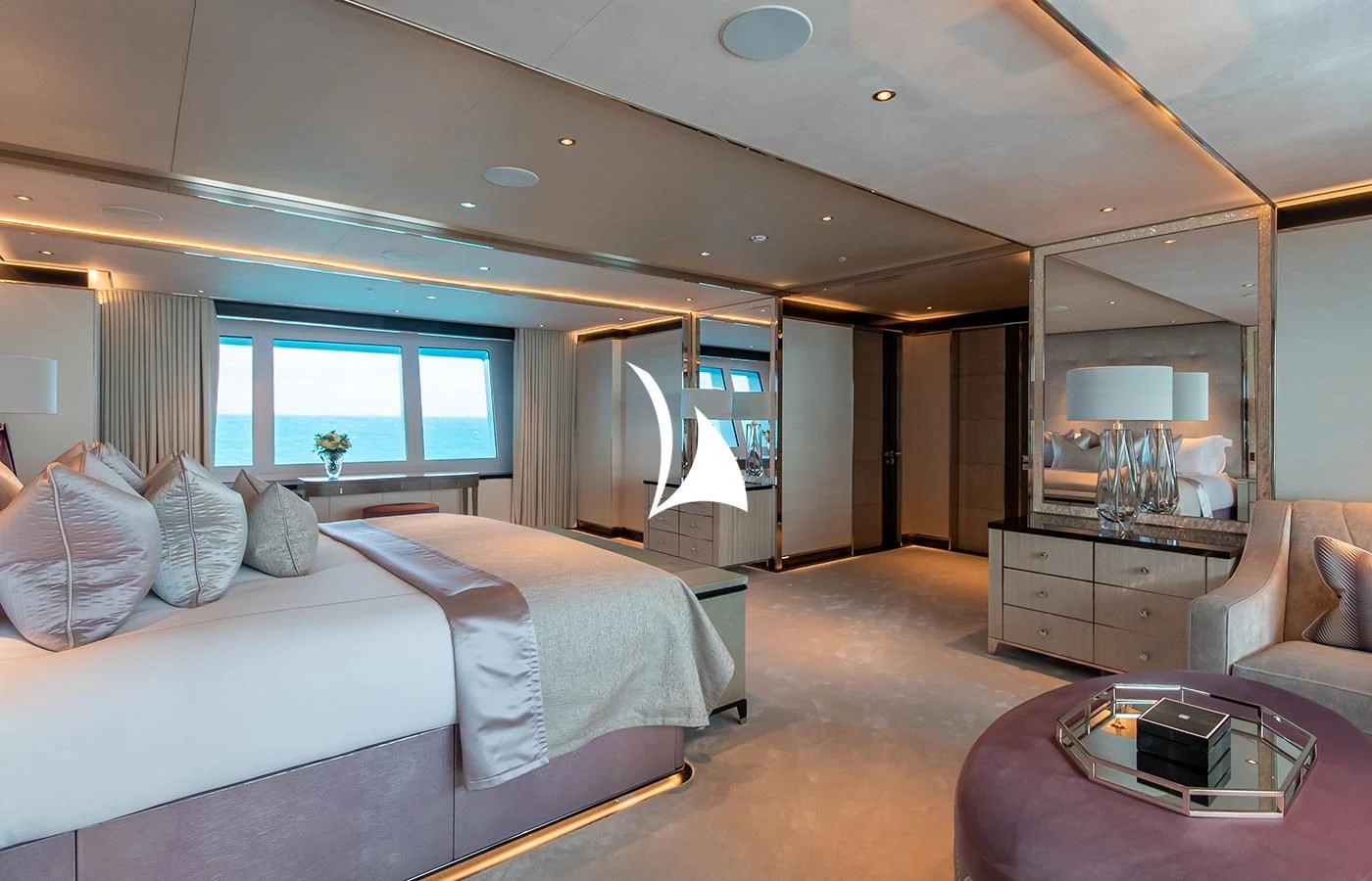 a room with a bed and a table aboard NORTH STAR Yacht for Sale