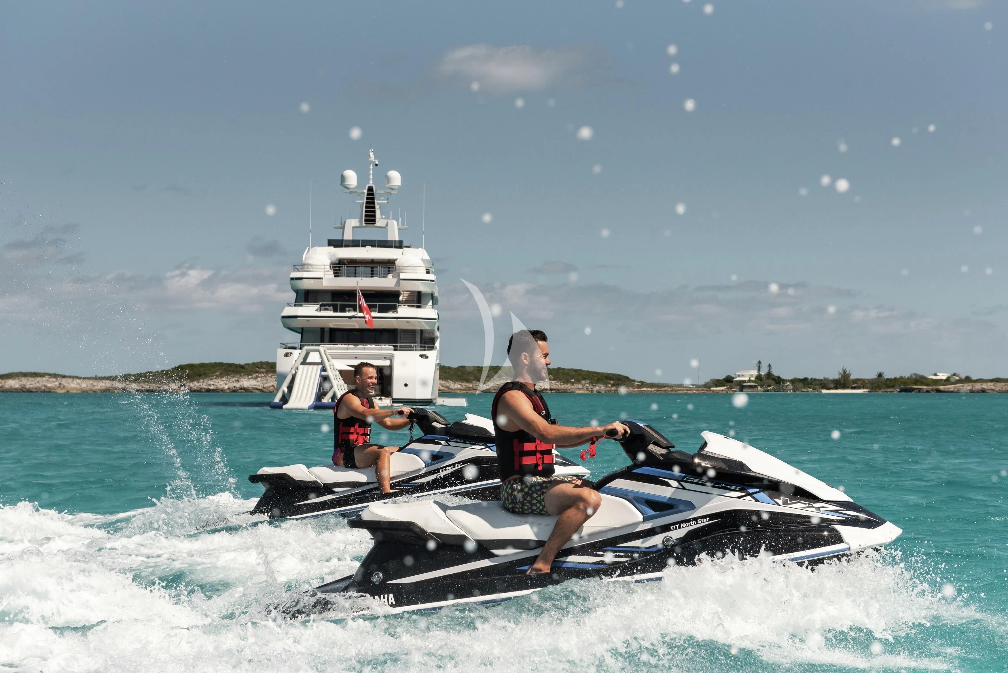 a group of people on a jet ski in the water aboard NORTH STAR Yacht for Sale