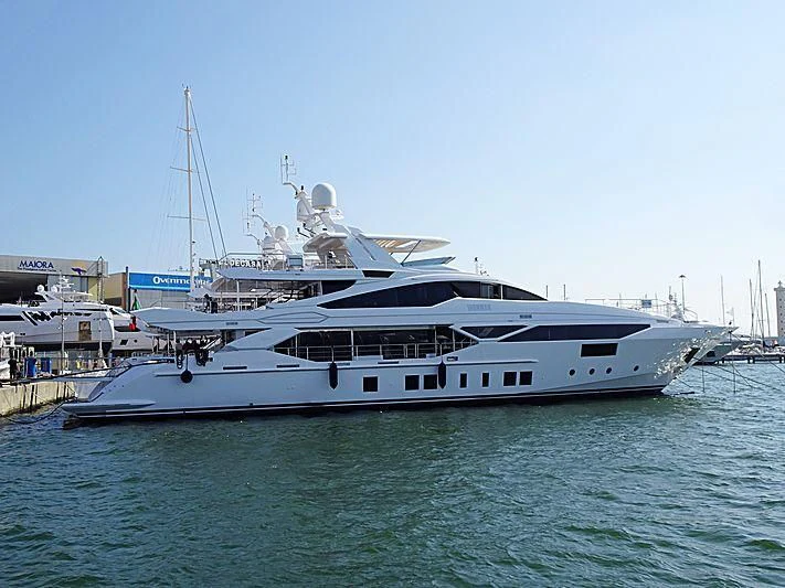 a large white boat in a harbor aboard IRONMAN Yacht for Sale