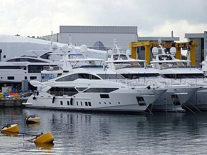 a large white yacht docked aboard IRONMAN Yacht for Sale