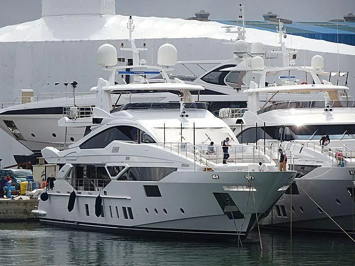 a group of boats in a harbor aboard IRONMAN Yacht for Sale
