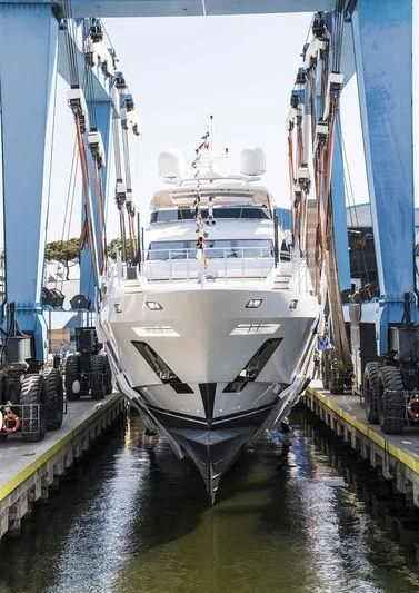 a large white boat docked aboard IRONMAN Yacht for Sale