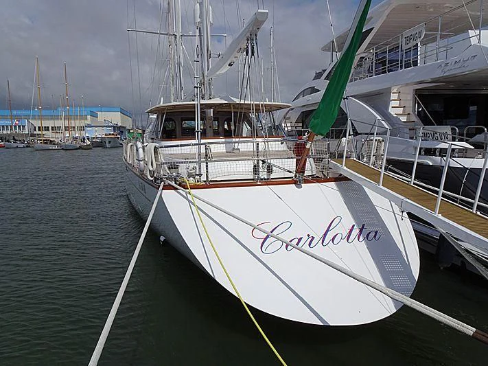 a boat docked at a pier aboard CARLOTTA Yacht for Sale