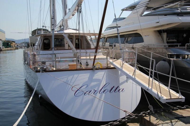 a boat docked at a pier aboard CARLOTTA Yacht for Sale