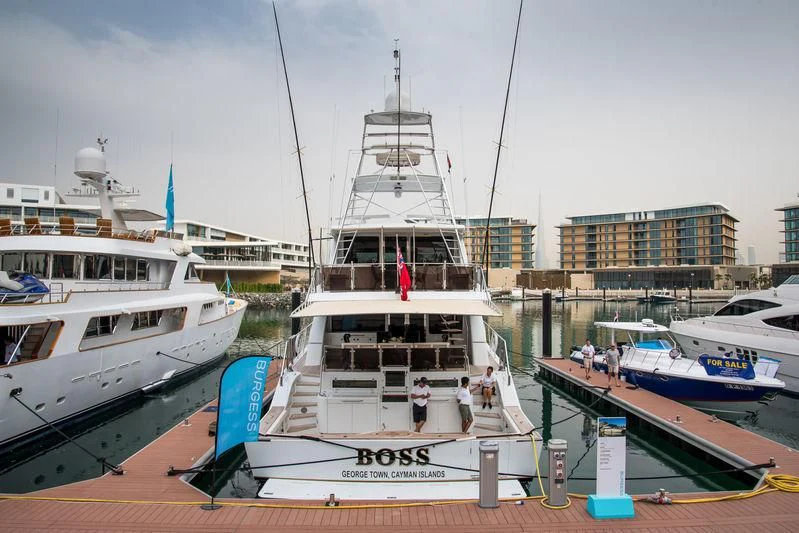 a boat docked at a pier aboard BOSS Yacht for Sale