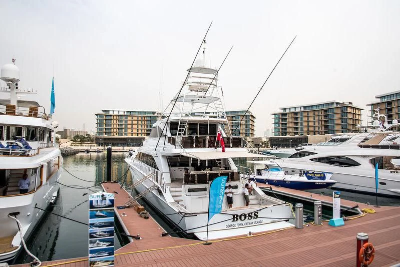 boats docked at a pier aboard BOSS Yacht for Sale