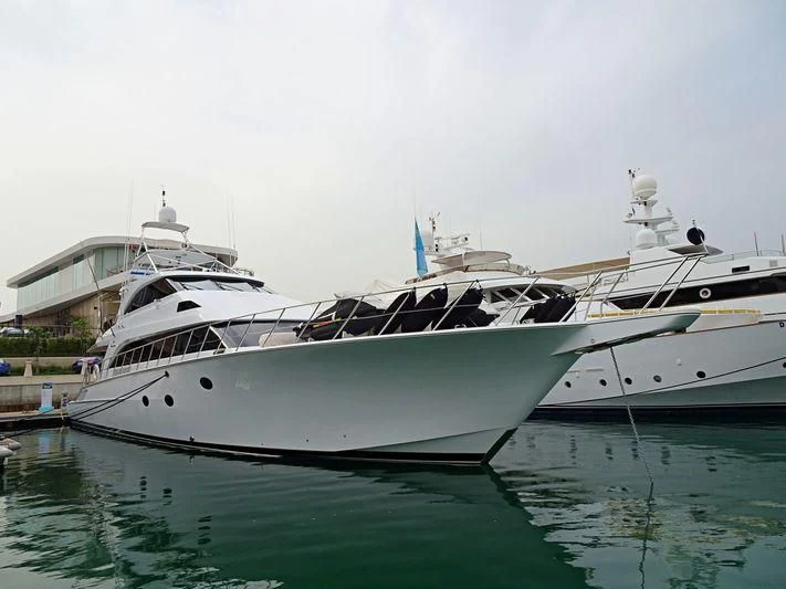 a white yacht docked aboard BOSS Yacht for Sale