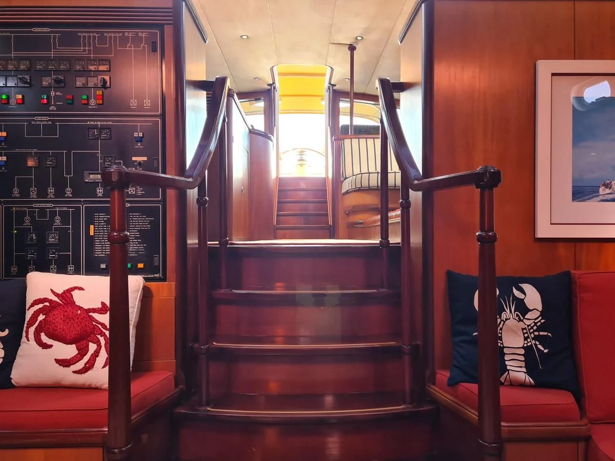 a red and black staircase aboard WHIRLWIND Yacht for Sale