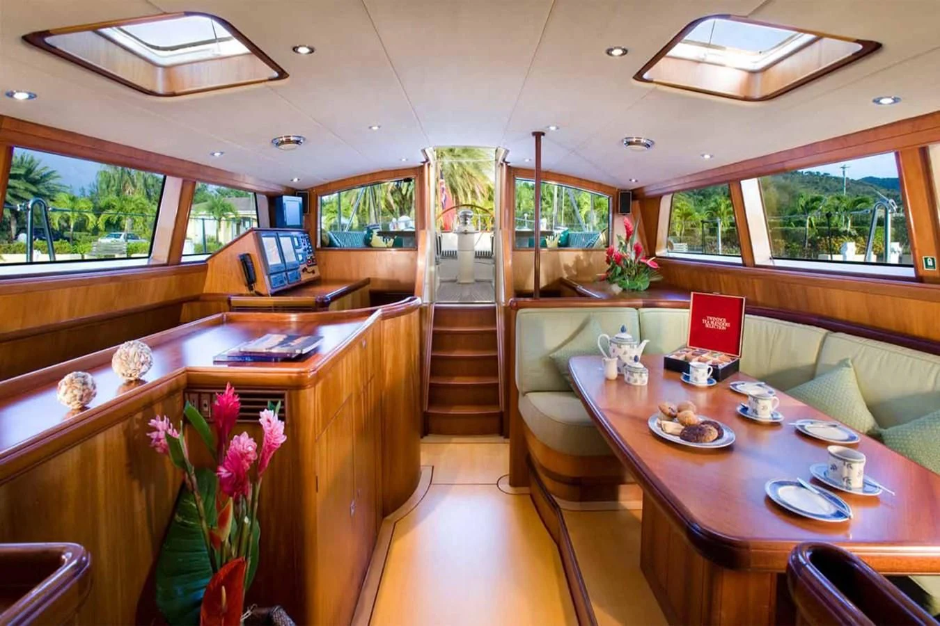 a large kitchen with a dining table aboard WHIRLWIND Yacht for Sale