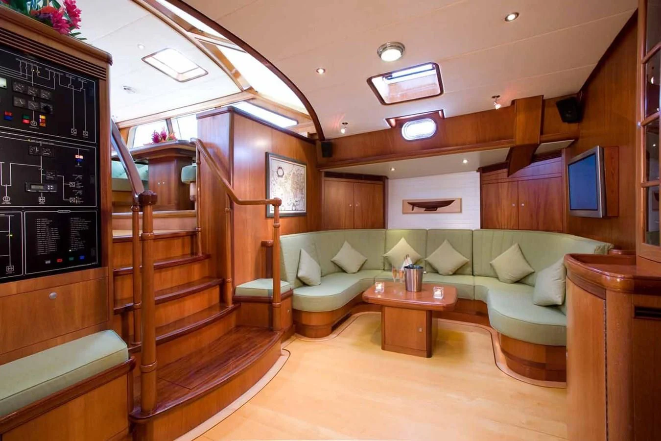 a room with a bed and a table aboard WHIRLWIND Yacht for Sale