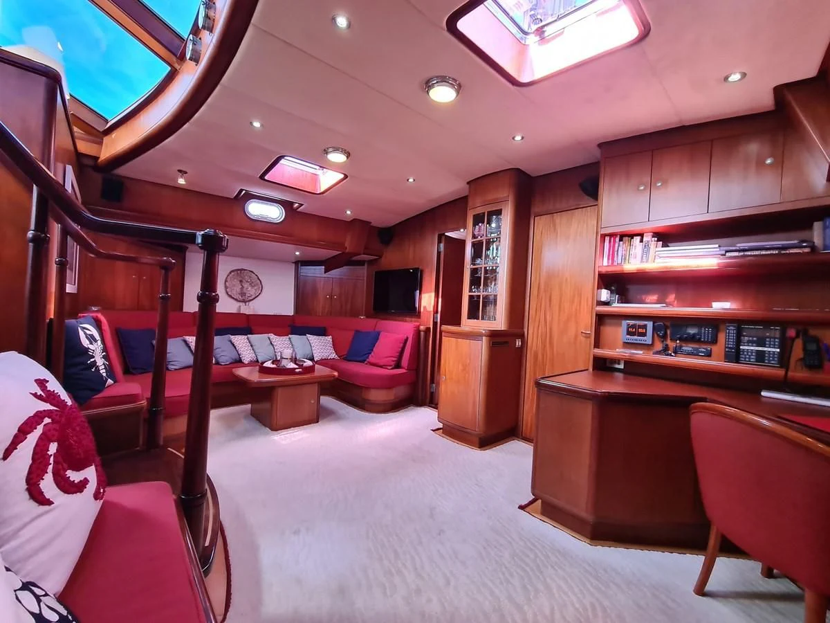 a room with a desk and chairs aboard WHIRLWIND Yacht for Sale