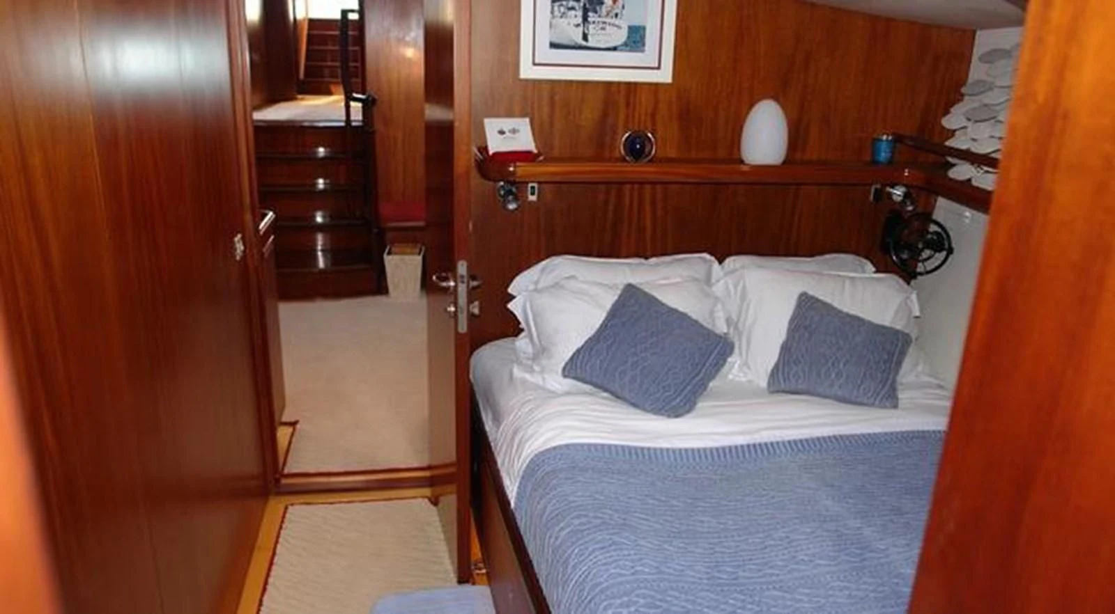 a bed with white sheets and pillows aboard WHIRLWIND Yacht for Sale