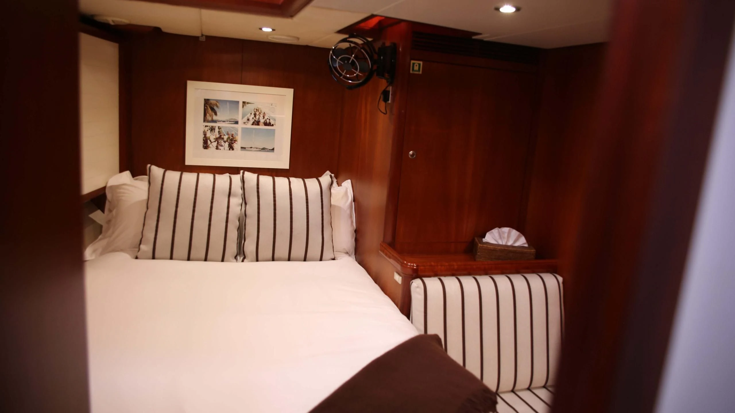 a bed with white sheets aboard WHIRLWIND Yacht for Sale
