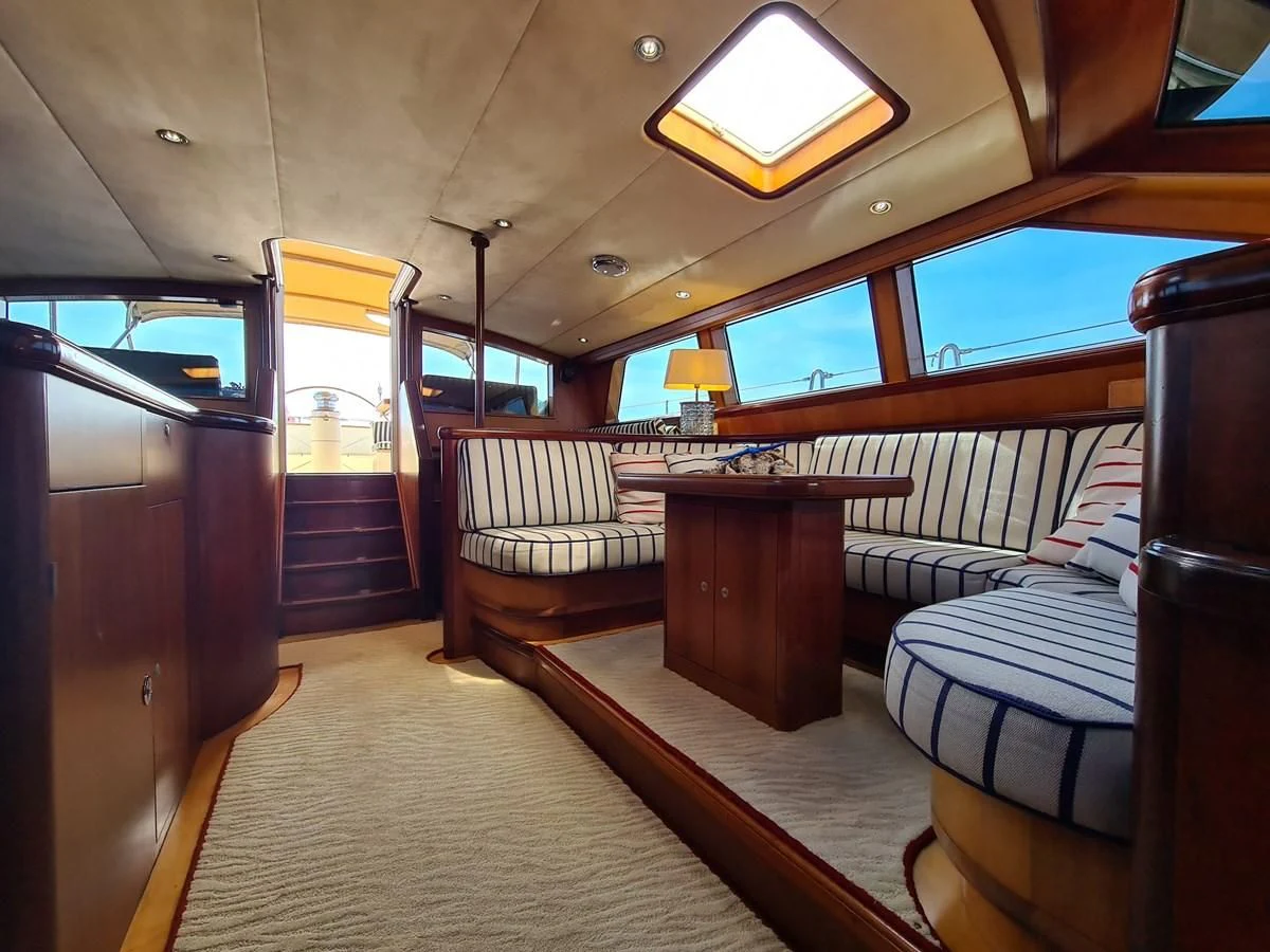 a train car with a table and chairs aboard WHIRLWIND Yacht for Sale