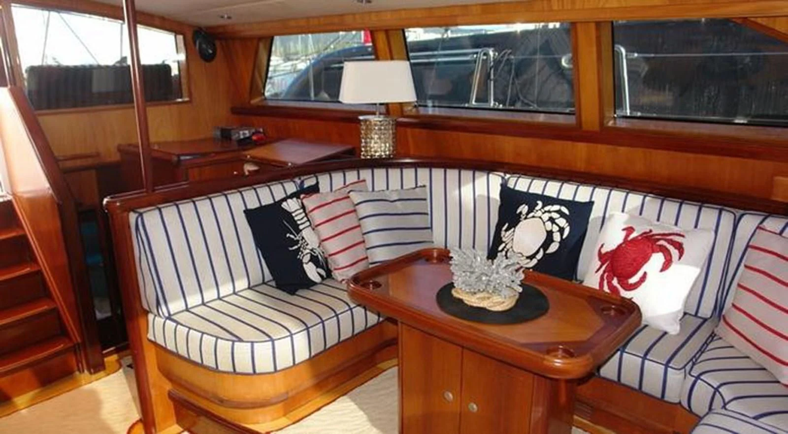 a room with a couch and a coffee table aboard WHIRLWIND Yacht for Sale