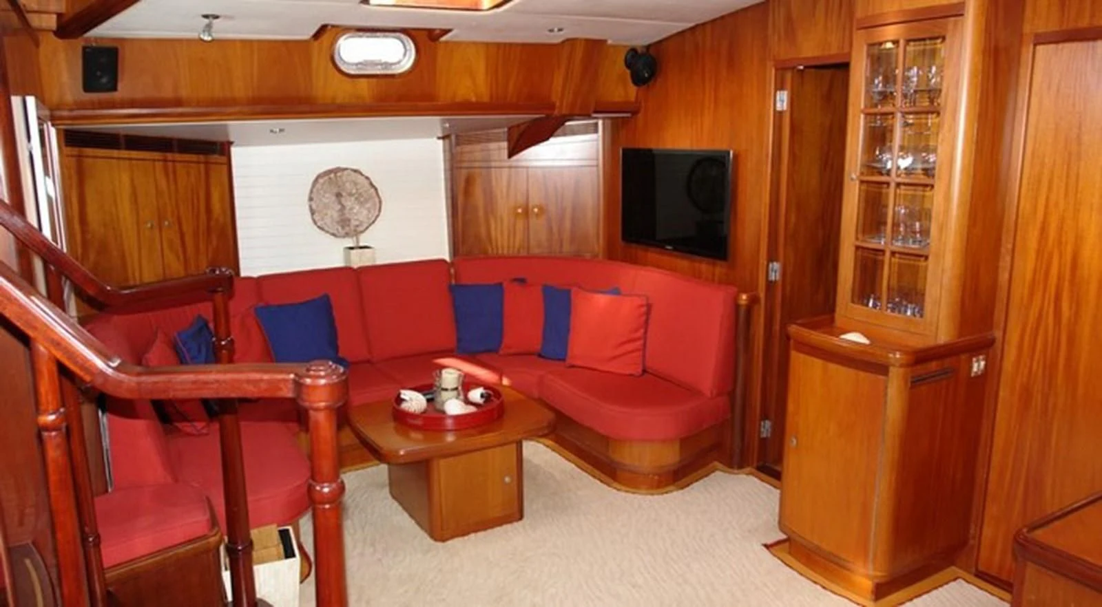 a living room with a couch and a table aboard WHIRLWIND Yacht for Sale