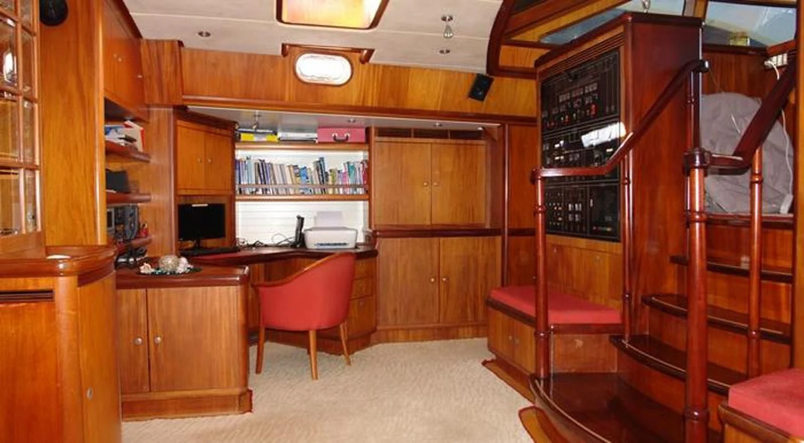 a room with a desk and a chair aboard WHIRLWIND Yacht for Sale