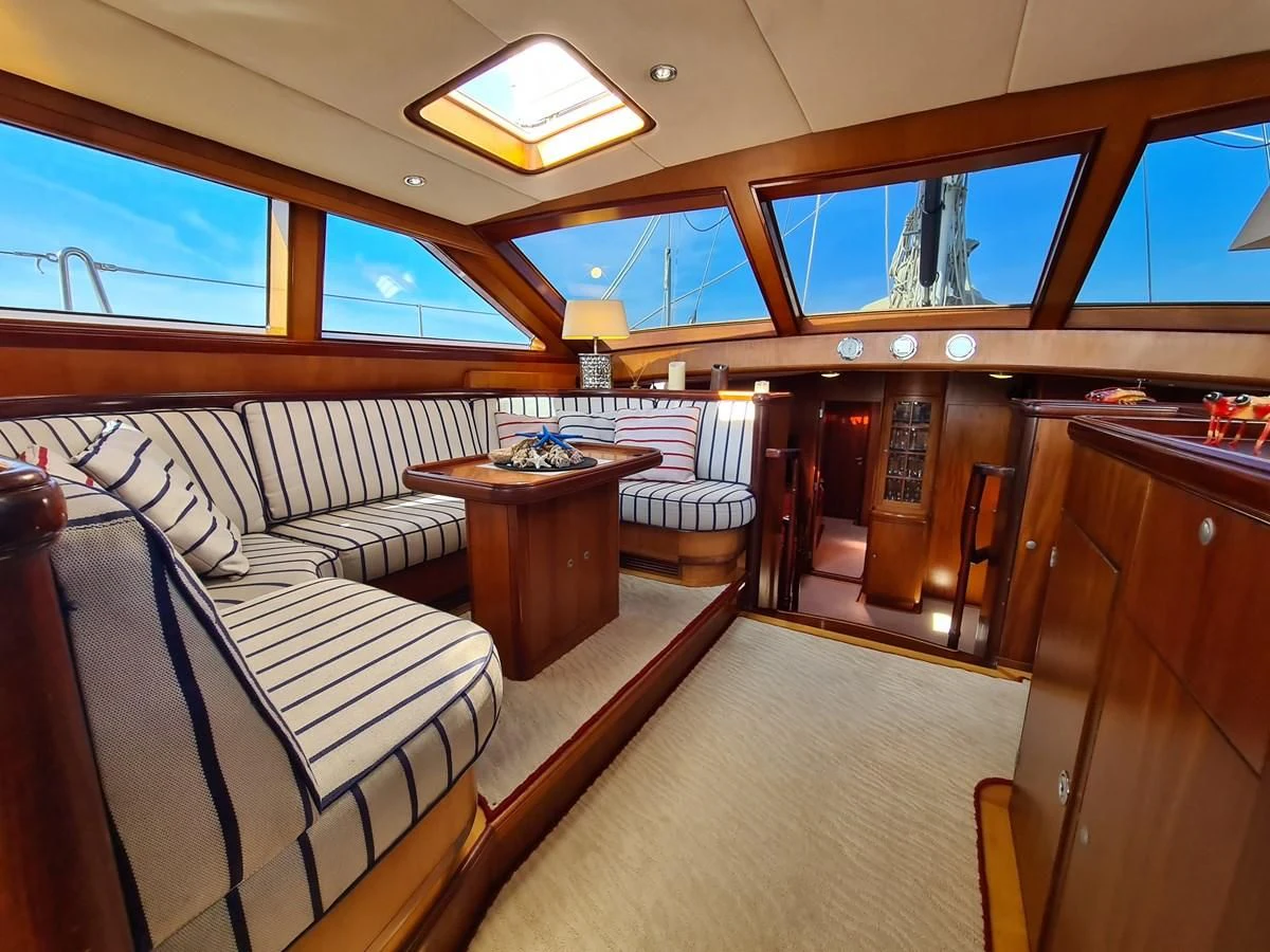 a room with couches and a table aboard WHIRLWIND Yacht for Sale