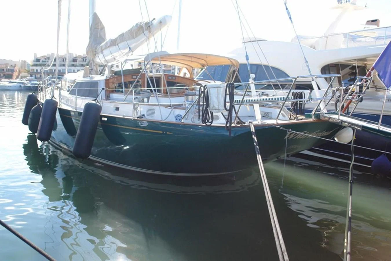 a boat docked at a pier aboard WHIRLWIND Yacht for Sale